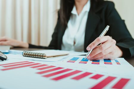 business man financial inspector and secretary making report, calculating or checking balance.  Audit conceptの写真素材