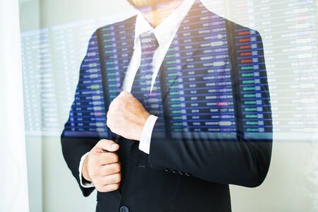 Double exposure People, business,fashion and clothing concept - close up of man in shirt dressing up and adjusting tie on neck at home.の写真素材