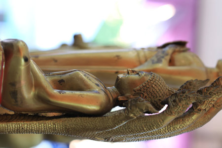 Close up golden buddha statue in buddhist templeの写真素材