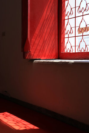 Close up classic light and shadow through the temple window