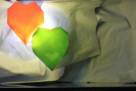 Close up transparency colorful paper hearts on white backgroundの写真素材