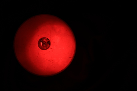 Close up transparency red plastic cup on black backgroundの写真素材