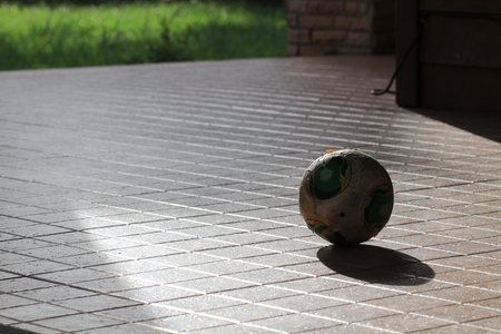 Small ball and shadow on brown groundの写真素材