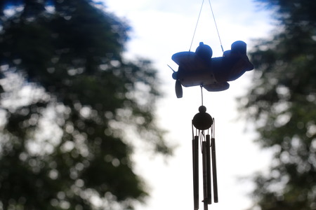 Silhouette of small hanging wood planeの写真素材
