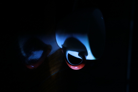 The Heart from light and shadow on coffee cup and reflection on the groundの写真素材