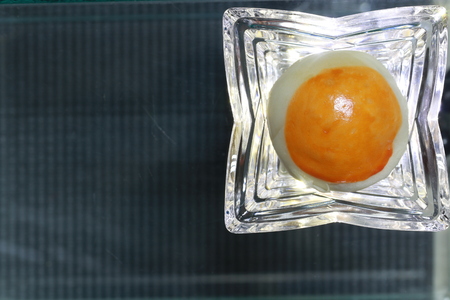 Top view of chinese pastry on transparency glass cup on grey groundの写真素材