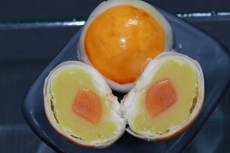 Top view of chinese pastry on transparency  glass dish on black groundの写真素材