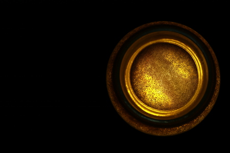 Top view of transparent honey bee in small glass cup on black backgroundの写真素材