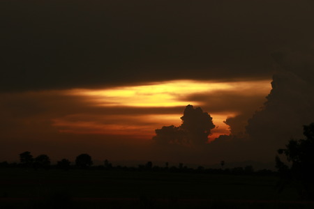 Orange light in the evening and clouds skyの写真素材