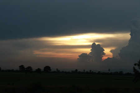 Orange light in the evening and clouds skyの写真素材