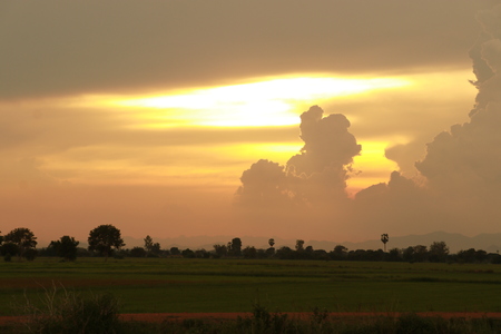 Orange light in the evening and clouds skyの写真素材