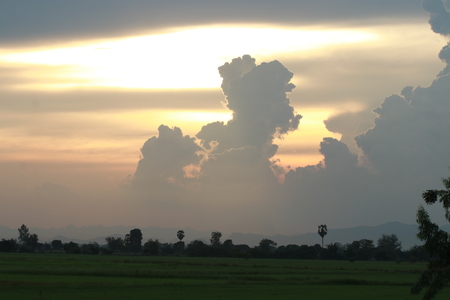 Orange light in the evening and clouds skyの写真素材