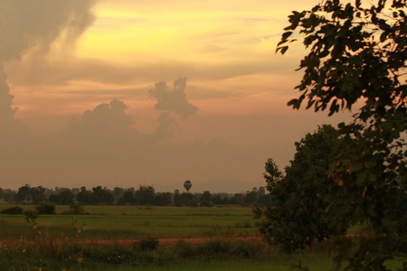 Orange light in the evening and clouds skyの写真素材