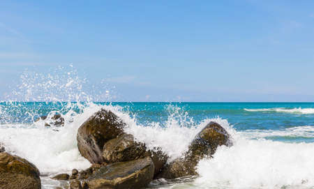 sea water impact the rocksの写真素材