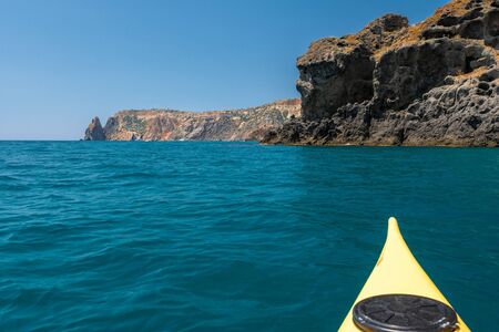sea kayaking near the mountain coastの写真素材