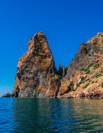 view on coastal cliffs, rock Orest and Pilad, cape Fiolent in Balaklava, Sevastopol Crimea. Bright sunny day, calm cristal clear blue sea. The concept of calmness silence and unity with natureの写真素材