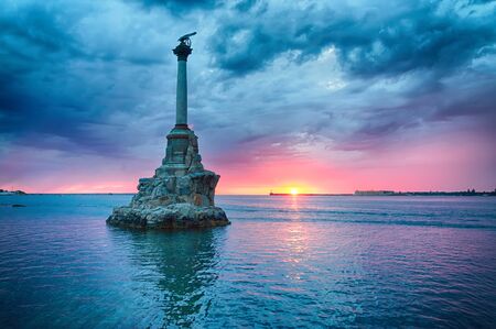 Monument to the flooded ships against the backdrop of the beautiful cloudy sunset. Sevastopol, Crimeaの写真素材