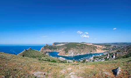 Scenic panoramic view of Balaclava bay with yachts from the ruines of Genoese fortress Chembalo. Balaklava, Sevastopol, Crimea. Inspirational travel landscape. Aerial photo. Copy space.の写真素材