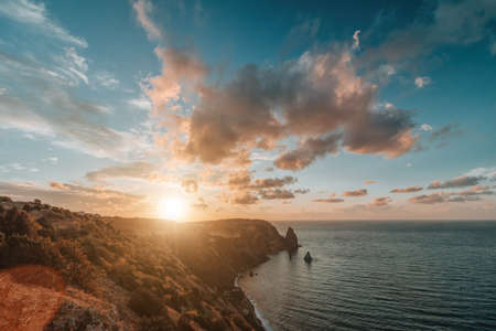Panoramic seascape, view on rocky seashore, calm azure sea and bright sunset. Copy space. Copy space. Beauty world, nature and outdoors travel conceptの写真素材