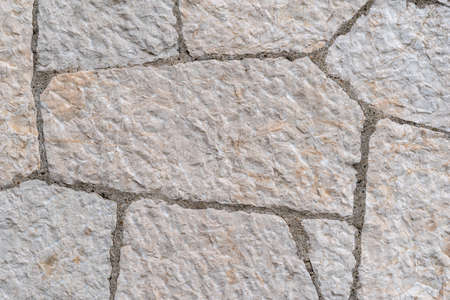 Decorative limestone on facade of the building as a background or backdrop. stone wall texture...