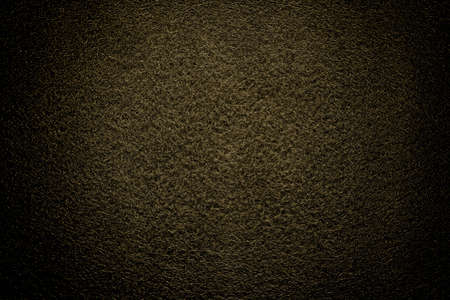 A close up of orange felt material background. Abstract background with yellow texture, velvet...