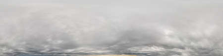 sky panorama on overcast rainy day with low clouds in seamless spherical equirectangular format with complete zenith for use in 3D graphics, game and for aerial drone 360 degree panorama as a sky domeの写真素材