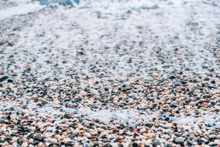 Abstract nature summer or spring ocean sea background. Small waves on golden warm water surface in...