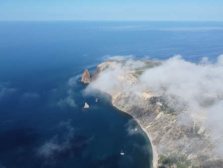 Abstract aerial nature summer ocean sunset sea and sky background. Natural sky with puffy Cumulus clouds composition. Sky replacement for composites. Holiday, vacation and recreational conceptの写真素材