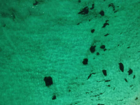 Aerial panoramic view of seascape with crystal clear azure sea and rocky shores. Yachts in a...