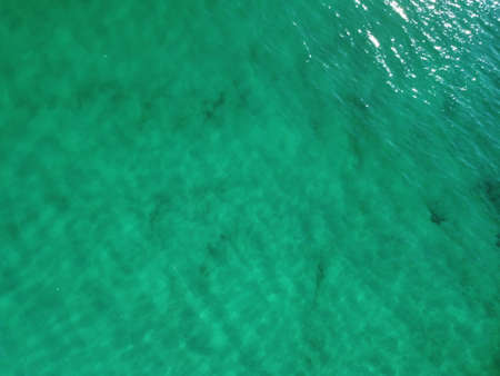 Aerial panoramic view of seascape with crystal clear azure sea and rocky shores. Yachts in a...