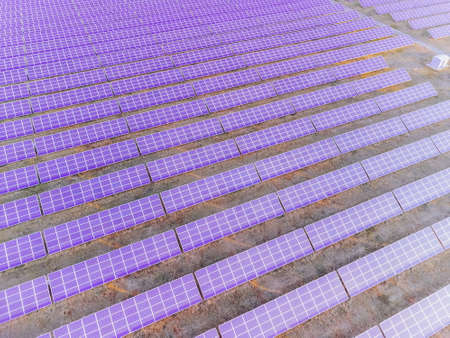 Aerial top view of a solar panels power plant. Photovoltaic solar panels at sunrise and sunset in...