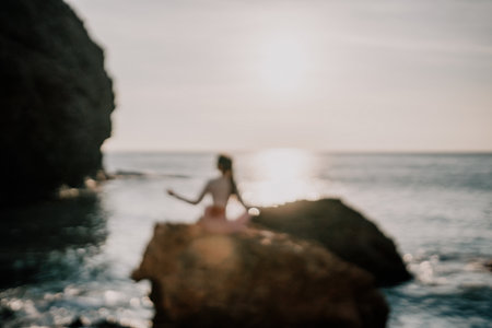 Young woman with black hair, fitness instructor in pink leggingsの写真素材