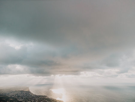Aerial view. The drone flies over foggy and fluffy clouds. Blue sky sun and sea fog. Abstract aerial...