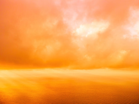 Aerial view red burning sunset over the sea with rocky volcanic cliff. Abstract nature summer sunset...