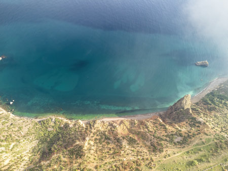 Aerial view. The drone flies over foggy and fluffy clouds. Blue sky sun and sea fog. Abstract aerial nature summer ocean sunset sea and sky background. Horizon. Vacation, travel and holiday conceptの写真素材