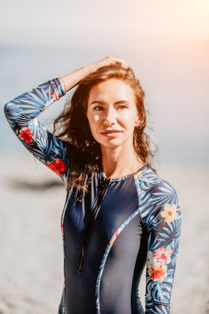 Portrait woman sea. Well looking middle aged woman with black hair, fitness instructor in blue...