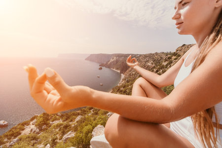 Woman sea pilates. Sporty middle-aged woman training in pilates on yoga mat by sea. concepts of health, wellness, and mindfulness in exercise, promoting the benefits of active and balanced lifestyleの写真素材