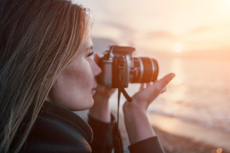 Woman travel sea. Happy tourist enjoy taking picture outdoors for memories. Woman traveler looks at...