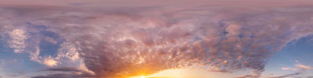 Bright sunset sky panorama with glowing red pink Cumulus clouds. HDR 360 seamless spherical...