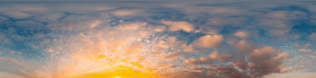 Sunset sky panorama with bright glowing pink Cumulus clouds. HDR 360 seamless spherical panorama....