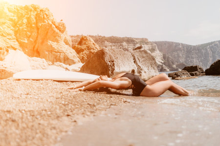 Woman summer travel sea. Happy tourist enjoy taking picture outdoors for memories. Woman traveler posing on the beach at sea surrounded by volcanic mountains, sharing travel adventure journeyの写真素材