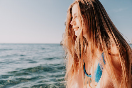 Woman sea sup. Close up portrait of happy young caucasian woman with long hair looking at camera and...