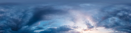 Dramatic sunset sky panorama with bright glowing red pink Cumulus clouds. HDR 360 seamless spherical...