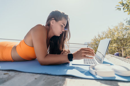 Woman laptop sea. Working remotely on seashore. Happy successful woman female freelancer working on...