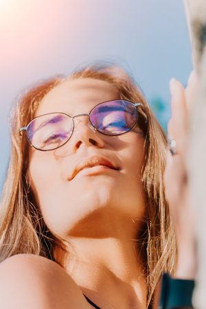 Woman summer travel. Happy tourist enjoy taking selfie photo outdoors for memories. Woman traveler...