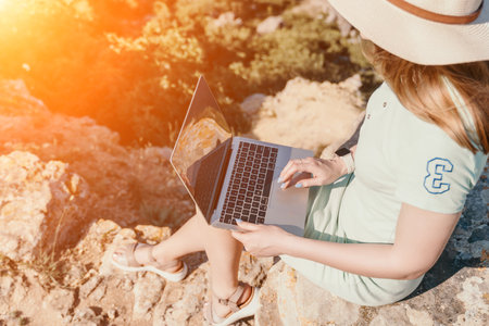 Woman sea laptop. Business woman, freelancer with laptop working over blue sea beach. Happy smiling...