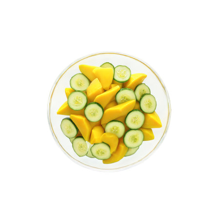 Mango cucumber salad with sliced mangoes cucumbers red onions and a lime dressing in aの素材