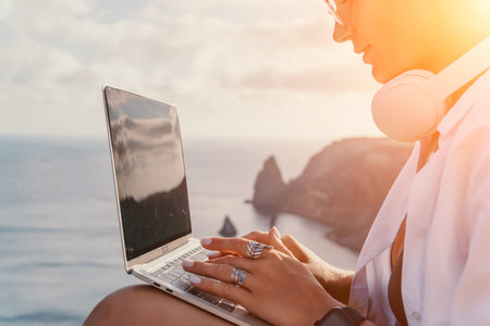 Woman sea laptop. Business woman, freelancer with laptop working over blue sea beach. Happy smiling...