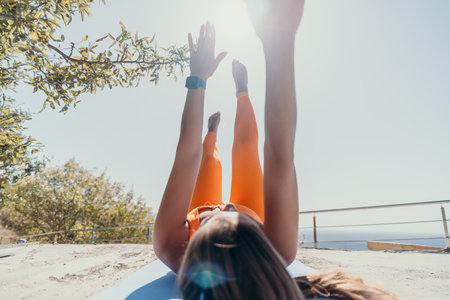 Woman Practicing Yoga Pose Outdoorsの写真素材