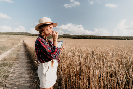 Young Woman Inspecting Wheat Field